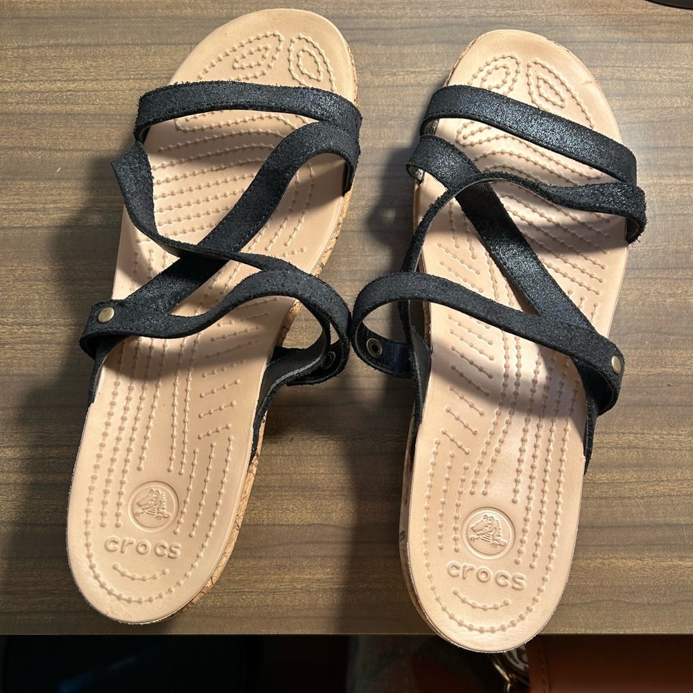 3 pair of shoes. 2 pair of Crocs sandals and one pair of Toms size 10